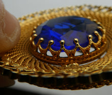 Load image into Gallery viewer, Vintage Costume Brooch with Heart Shapes on Rim and Blue Faceted Glass Insert
