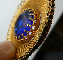 Load image into Gallery viewer, Vintage Costume Brooch with Heart Shapes on Rim and Blue Faceted Glass Insert

