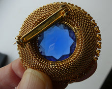 Load image into Gallery viewer, Vintage Costume Brooch with Heart Shapes on Rim and Blue Faceted Glass Insert

