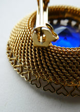 Load image into Gallery viewer, Vintage Costume Brooch with Heart Shapes on Rim and Blue Faceted Glass Insert
