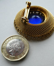 Load image into Gallery viewer, Vintage Costume Brooch with Heart Shapes on Rim and Blue Faceted Glass Insert
