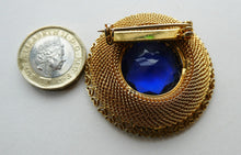 Load image into Gallery viewer, Vintage Costume Brooch with Heart Shapes on Rim and Blue Faceted Glass Insert
