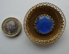 Load image into Gallery viewer, Vintage Costume Brooch with Heart Shapes on Rim and Blue Faceted Glass Insert
