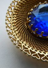 Load image into Gallery viewer, Vintage Costume Brooch with Heart Shapes on Rim and Blue Faceted Glass Insert
