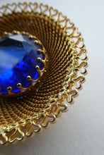 Load image into Gallery viewer, Vintage Costume Brooch with Heart Shapes on Rim and Blue Faceted Glass Insert
