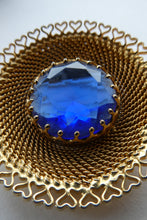 Load image into Gallery viewer, Vintage Costume Brooch with Heart Shapes on Rim and Blue Faceted Glass Insert
