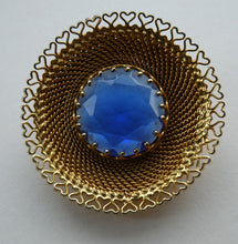 Load image into Gallery viewer, Vintage Costume Brooch with Heart Shapes on Rim and Blue Faceted Glass Insert
