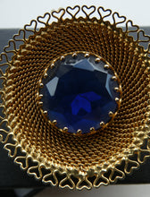 Load image into Gallery viewer, Vintage Costume Brooch with Heart Shapes on Rim and Blue Faceted Glass Insert
