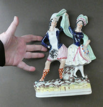 Load image into Gallery viewer, ANTIQUE Victorian Staffordshire Flatback Figurine. A Highlander and his Sweetheart Dancing. 10 inches
