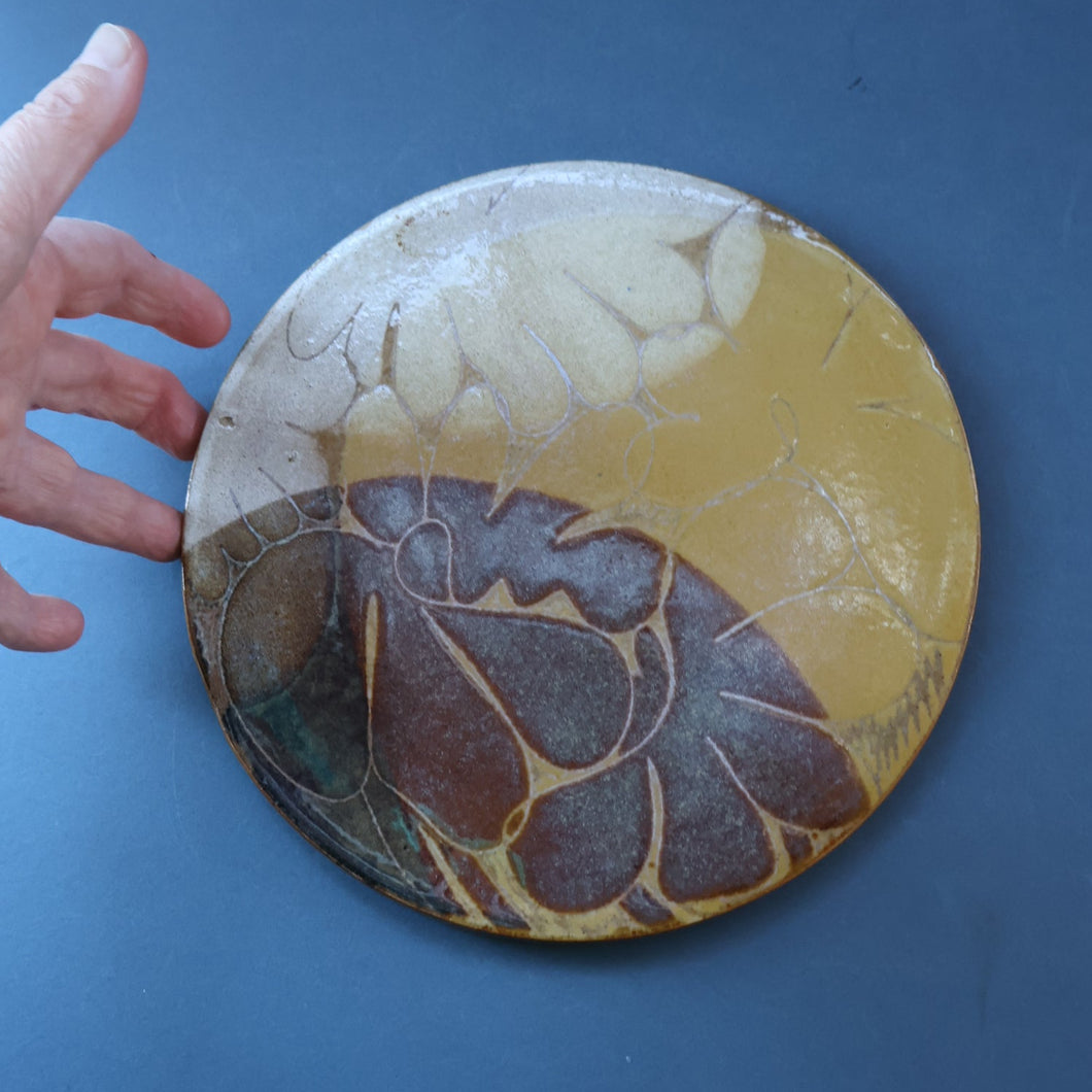 STUDIO POTTERY. Heavy Duty Trivet or Teapot Stand with Abstract Floral Motifs. Crich Pottery (Diana Worthy).  8 inches diameter