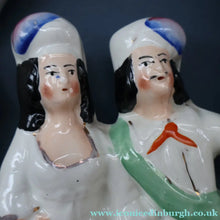 Load image into Gallery viewer, ANTIQUE Victorian 1880s Staffordshire Figurine. Courting Couple Sitting Underneath the Arch of a Bough Holding a Yellow Bird
