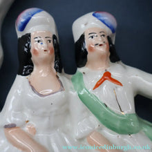 Load image into Gallery viewer, ANTIQUE Victorian 1880s Staffordshire Figurine. Courting Couple Sitting Underneath the Arch of a Bough Holding a Yellow Bird
