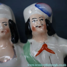 Load image into Gallery viewer, ANTIQUE Victorian 1880s Staffordshire Figurine. Courting Couple Sitting Underneath the Arch of a Bough Holding a Yellow Bird
