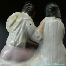 Load image into Gallery viewer, Antique 19th Century Staffordshire Figurine. Couple with a Nest 
