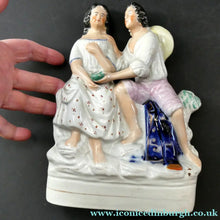 Load image into Gallery viewer, Antique 19th Century Staffordshire Figurine. Couple with a Nest 
