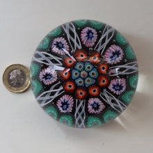 Load image into Gallery viewer, Fine VASART Scottish Glass Paperweight with 7 Short Spokes; with black ground, thick latticino spokes &amp; larger millefiori canes
