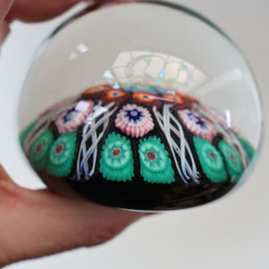 Fine VASART Scottish Glass Paperweight with 7 Short Spokes; with black ground, thick latticino spokes & larger millefiori canes