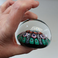 Load image into Gallery viewer, Fine VASART Scottish Glass Paperweight with 7 Short Spokes; with black ground, thick latticino spokes &amp; larger millefiori canes
