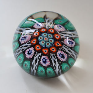 Fine VASART Scottish Glass Paperweight with 7 Short Spokes; with black ground, thick latticino spokes & larger millefiori canes