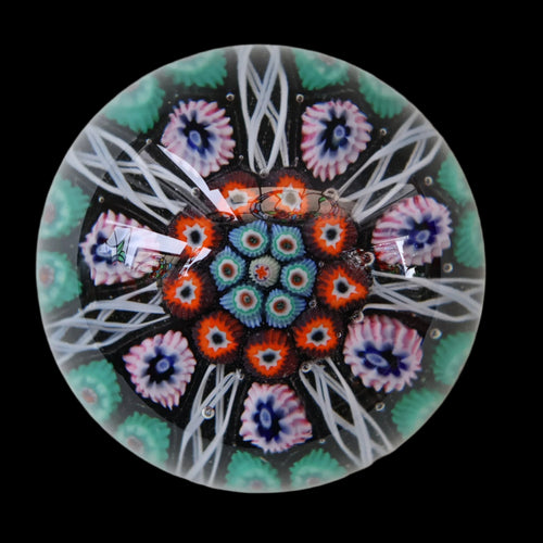 Fine VASART Scottish Glass Paperweight with 7 Short Spokes; with black ground, thick latticino spokes & larger millefiori canes