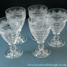 Load image into Gallery viewer, 1930s ART DECO Stuart Crystal FIVE Wine Glasses. With Cut Oval Facets and Engraved Fan Fringe Pattern. Height 4 1/2 inches
