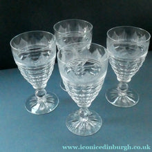 Load image into Gallery viewer, 1930s ART DECO Stuart Crystal FOUR Wine Glasses. With Cut Oval Facets and Engraved Fan Fringe Pattern. Height 5 3/8 inches
