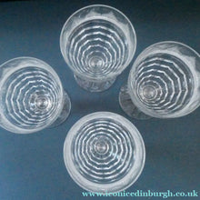 Load image into Gallery viewer, 1930s ART DECO Stuart Crystal FOUR Wine Glasses. With Cut Oval Facets and Engraved Fan Fringe Pattern. Height 5 3/8 inches
