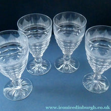 Load image into Gallery viewer, 1930s ART DECO Stuart Crystal FOUR Wine Glasses. With Cut Oval Facets and Engraved Fan Fringe Pattern. Height 5 3/8 inches
