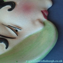 Load image into Gallery viewer, 1930s ART DECO Wall Mask by Cope &amp; Co. Art Deco Lady with Green Bonnet with Pink Flower. Black Hair
