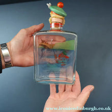 Load image into Gallery viewer, 1930s NOVELTY Golfing Glass Decanter. Decorated with Hand-Painted Comical Golfing Illustration - and with Fabulous Scotsman's Head Stopper
