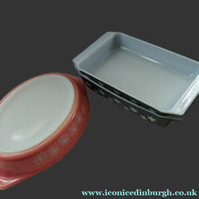Load image into Gallery viewer, Two Pyrex Dishes. No Lids. Black Oblong. Pink Oval. Snowflake Pattern
