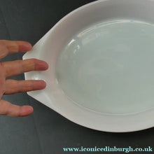 Load image into Gallery viewer, Two Pyrex Dishes. No Lids. Black Oblong. Pink Oval. Snowflake Pattern
