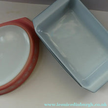 Load image into Gallery viewer, Two Pyrex Dishes. No Lids. Black Oblong. Pink Oval. Snowflake Pattern
