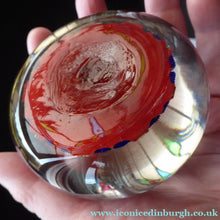 Load image into Gallery viewer, Fine VASART Scottish Glass Paperweight with 9 Spokes; with scarlet ground, latticino canes &amp; millefiore. 3 inches diameter
