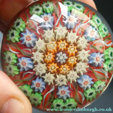 Load image into Gallery viewer,  VASART Scottish Glass Paperweight with 9 Spokes; with rose pink ground, latticino canes &amp; millefiori rosette
