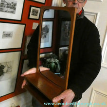Load image into Gallery viewer, 1960s DANISH Pedersen &amp; Hansen (P&amp;H) wall mirror in a teak wooden frame with a small integrated shelf.
