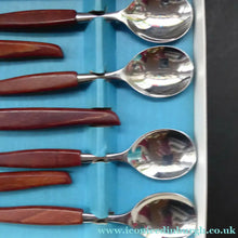 Load image into Gallery viewer, Vintage 1960s GLOSSWOOD Cutlery. Stainless Steel Six Dessert Spoons &amp; Larger Serving Spoon with Teak Effect Handles. Original Retail Box
