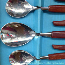 Load image into Gallery viewer, Vintage 1960s GLOSSWOOD Cutlery. Stainless Steel Six Dessert Spoons &amp; Larger Serving Spoon with Teak Effect Handles. Original Retail Box
