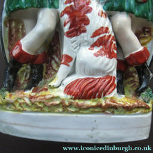 Load image into Gallery viewer, Antique Victorian Spill Vase Featuring a Pair of Huntsmen Wearing Short Green Tunics with a Large Dog
