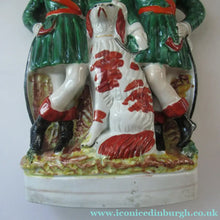 Load image into Gallery viewer, Antique Victorian Spill Vase Featuring a Pair of Huntsmen Wearing Short Green Tunics with a Large Dog
