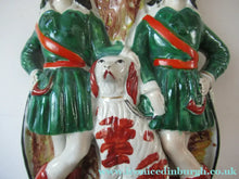 Load image into Gallery viewer, Antique Victorian Spill Vase Featuring a Pair of Huntsmen Wearing Short Green Tunics with a Large Dog

