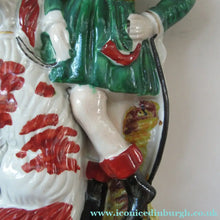 Load image into Gallery viewer, Antique Victorian Spill Vase Featuring a Pair of Huntsmen Wearing Short Green Tunics with a Large Dog
