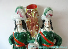 Load image into Gallery viewer, Antique Victorian Spill Vase Featuring a Pair of Huntsmen Wearing Short Green Tunics with a Large Dog - Staffordshire
