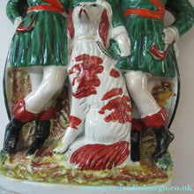 Load image into Gallery viewer, Antique Victorian Spill Vase Featuring a Pair of Huntsmen Wearing Short Green Tunics with a Large Dog
