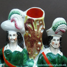 Load image into Gallery viewer, Antique Victorian Spill Vase Featuring a Pair of Huntsmen Wearing Short Green Tunics with a Large Dog
