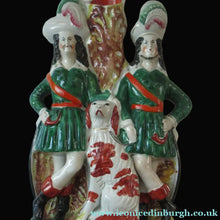 Load image into Gallery viewer, Antique Victorian Spill Vase Featuring a Pair of Huntsmen Wearing Short Green Tunics with a Large Dog
