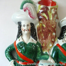 Load image into Gallery viewer, Antique Victorian Spill Vase Featuring a Pair of Huntsmen Wearing Short Green Tunics with a Large Dog
