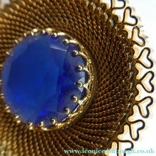 Load image into Gallery viewer, Vintage Costume Brooch with Heart Shapes on Rim and Blue Faceted Glass Insert
