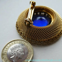 Load image into Gallery viewer, Vintage Costume Brooch with Heart Shapes on Rim and Blue Faceted Glass Insert
