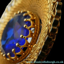 Load image into Gallery viewer, Vintage Costume Brooch with Heart Shapes on Rim and Blue Faceted Glass Insert
